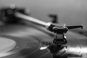 Close-up of a turntable arm and cartridge on a record